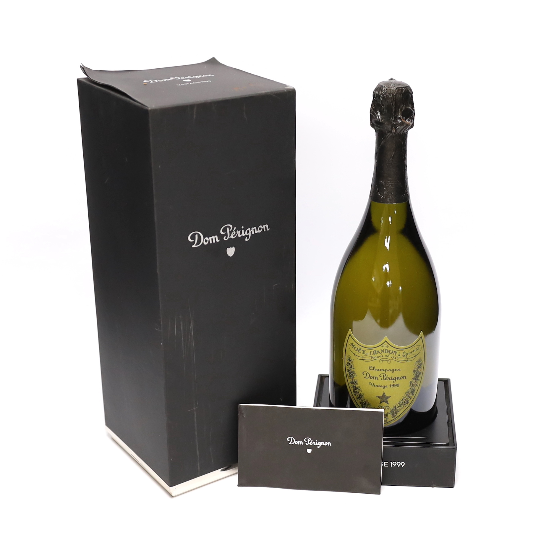 A bottle of Dom Perignon 1999 with booklet and box